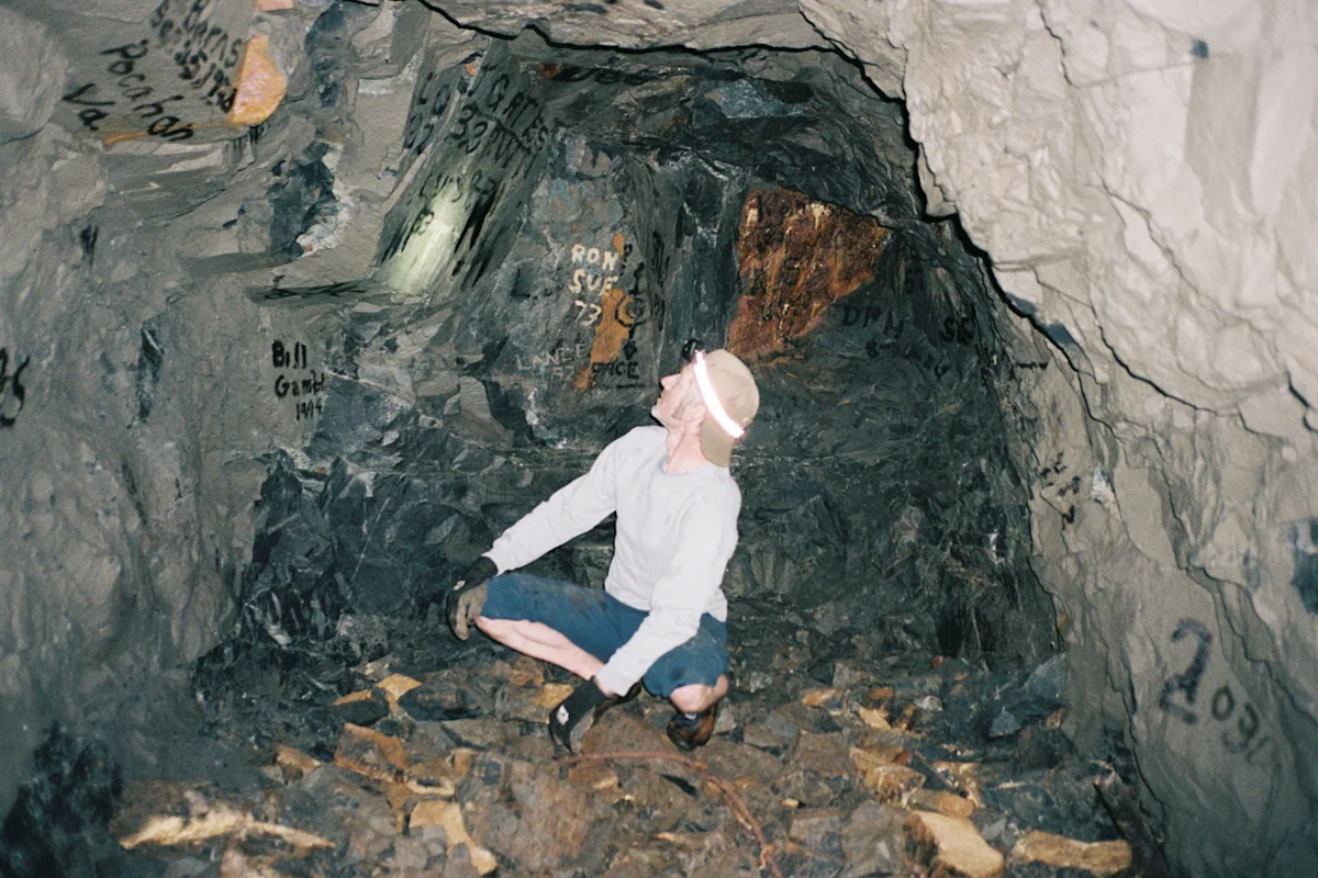 A researcher exploring the entrance of the Bonanza Mine site.