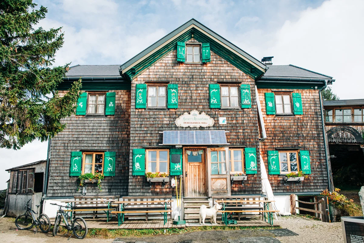 The Heinrich-Kiener-Haus mountain hut against a backdrop of steep mountain peaks.