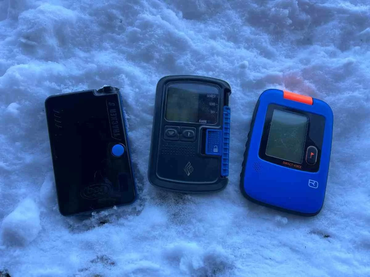 Side-by-side comparison of BCA Tracker, Black Diamond Guide BT, and Ortovox Diract Voice avalanche beacons.