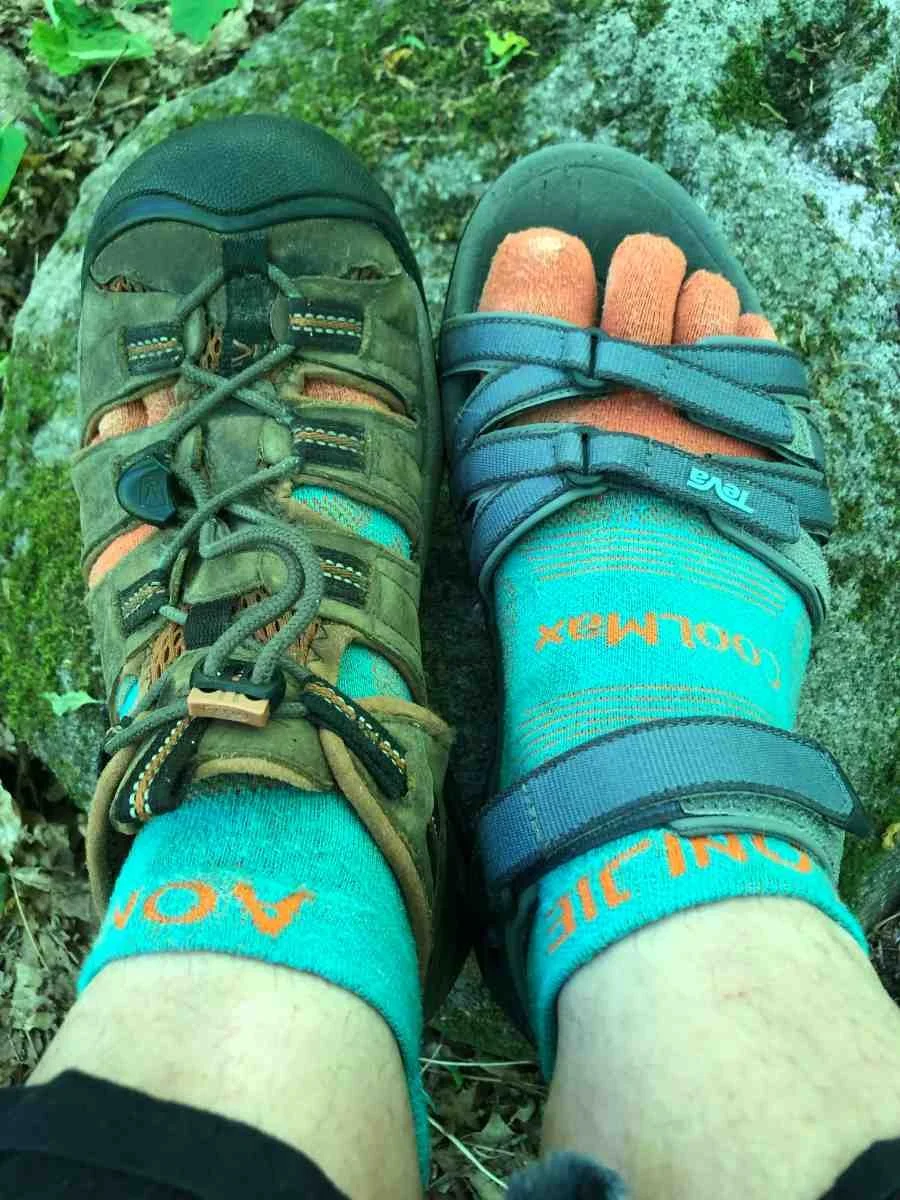 Close up of hiking sandals paired with technical socks for maximum breathability.