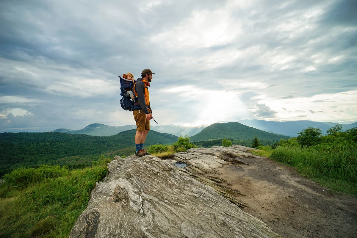 A family hiking together with professional outdoor gear.