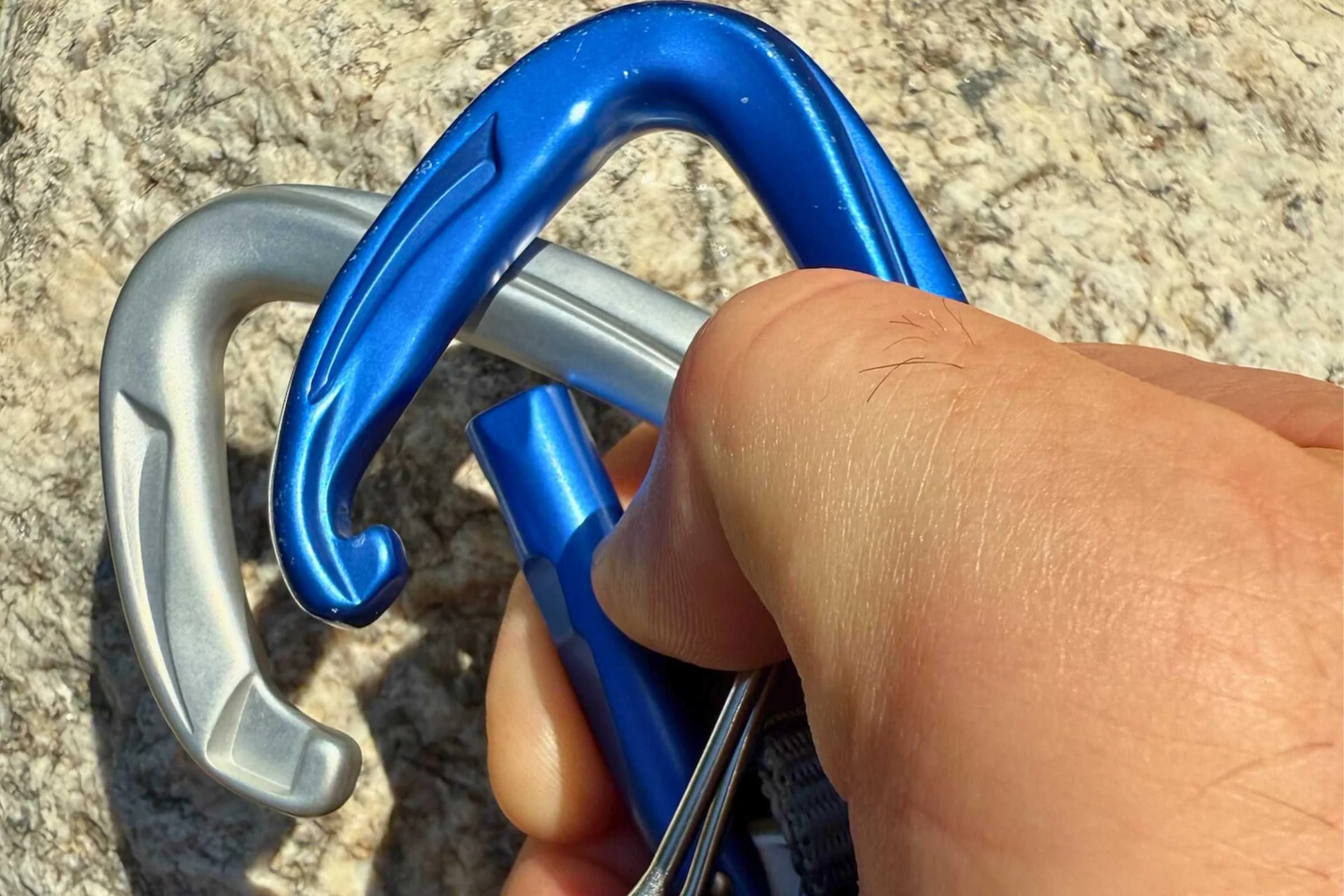 Side-by-side comparison of a keylock carabiner nose versus a hooked carabiner nose.