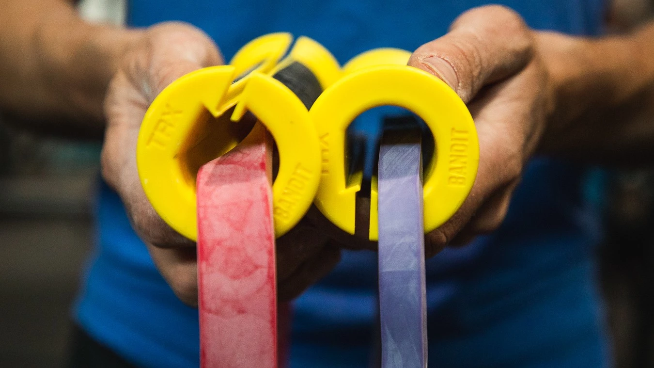 Continuous loop power bands attached to ergonomic TRX handles.
