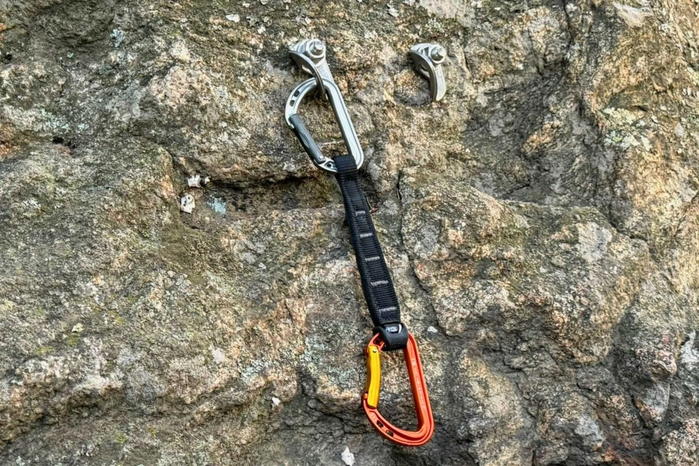 A close-up shot of the Petzl Spirit Express quickdraw with its ergonomic dogbone.