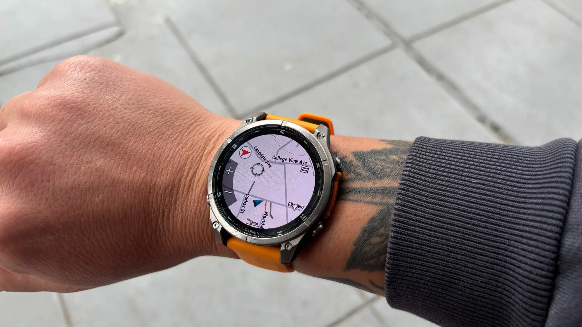 Garmin fenix 8 displaying a topographic GPS map on its face