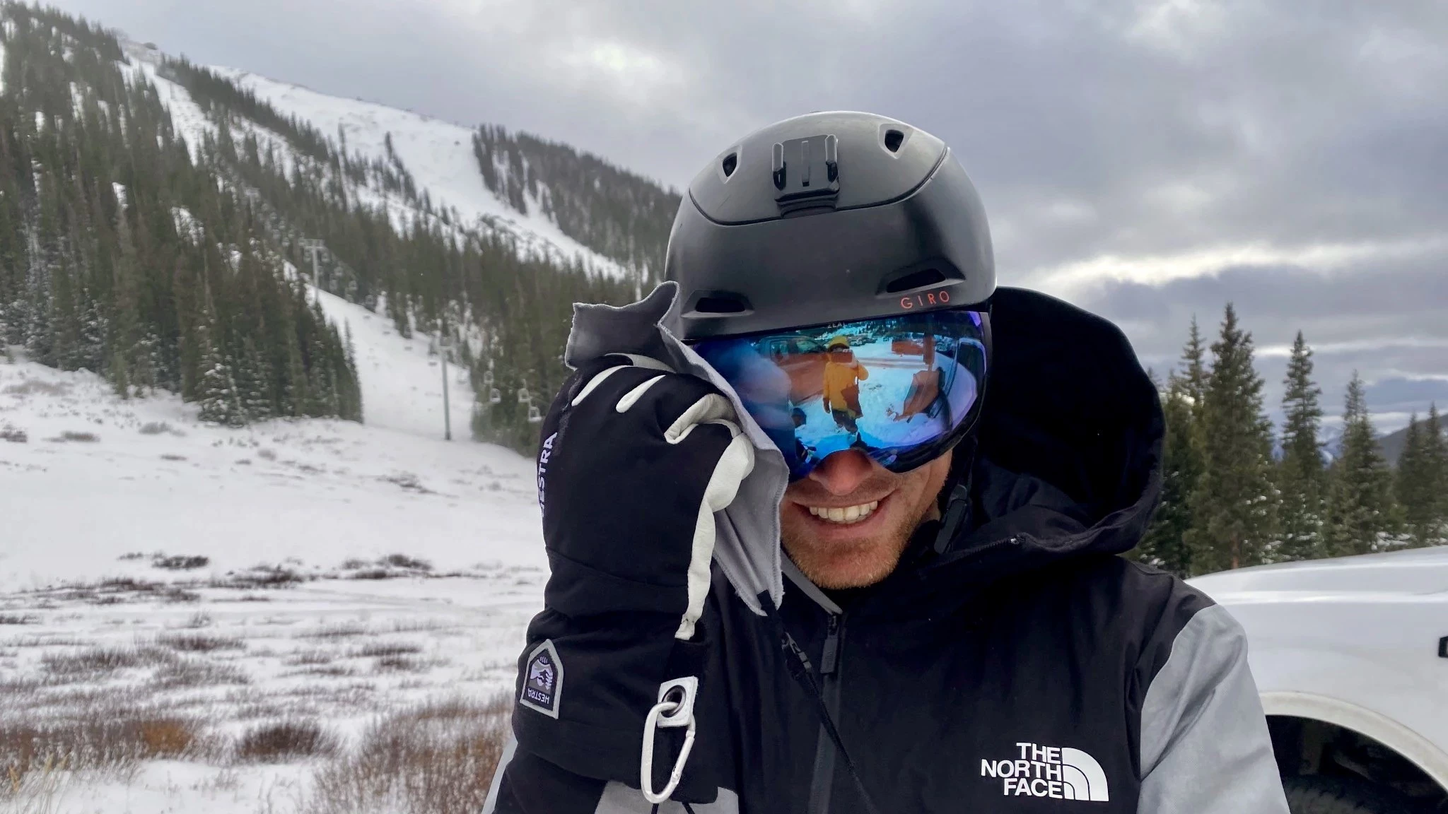 A goggle wipe attached to a tether inside a ski jacket sleeve pocket.