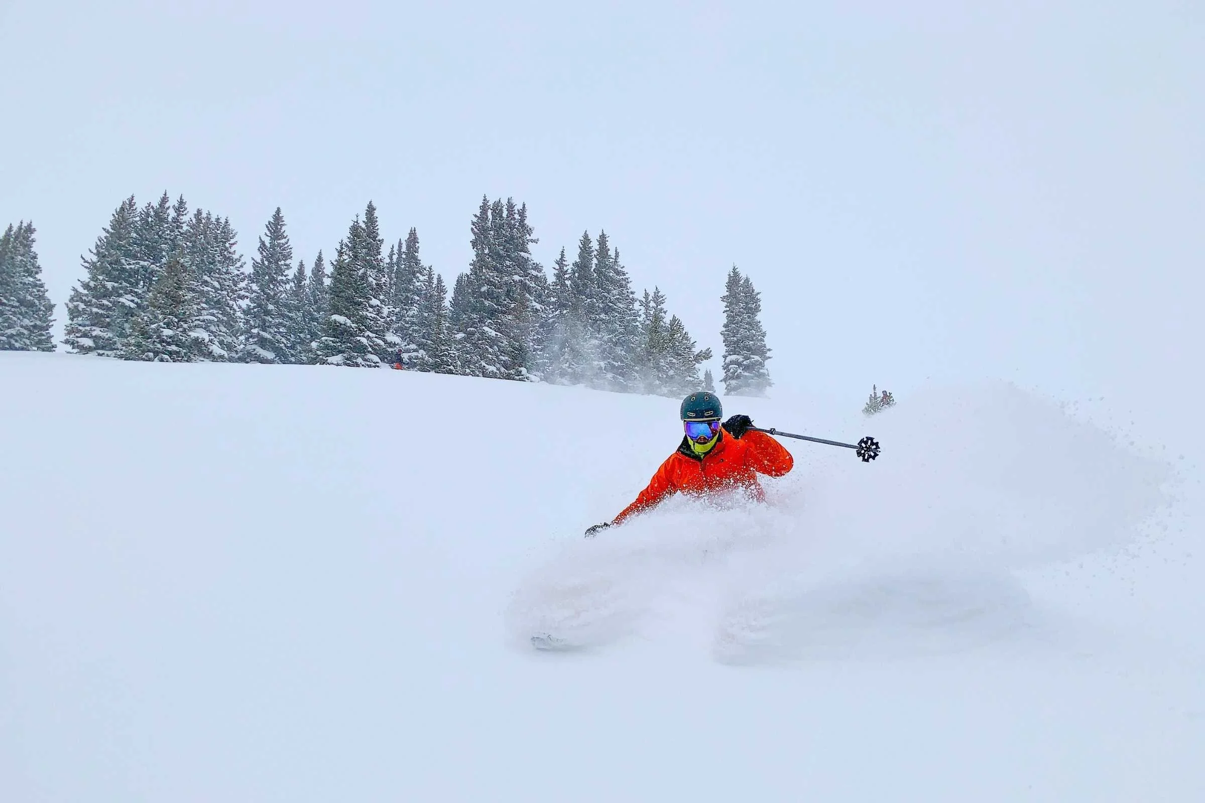 A skier in motion representing the multi-directional forces involved in a fall.
