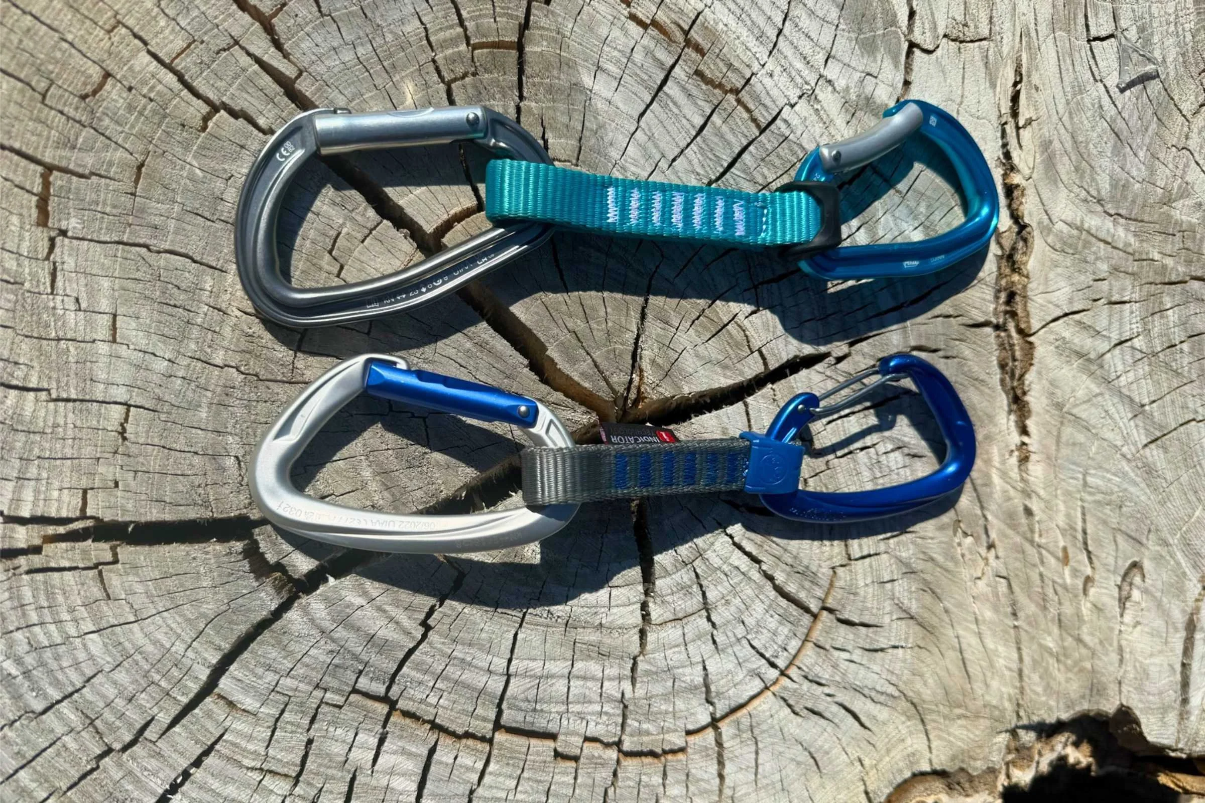 Collage showing a solid straight gate, a solid bent gate, and a wiregate carabiner side by side.