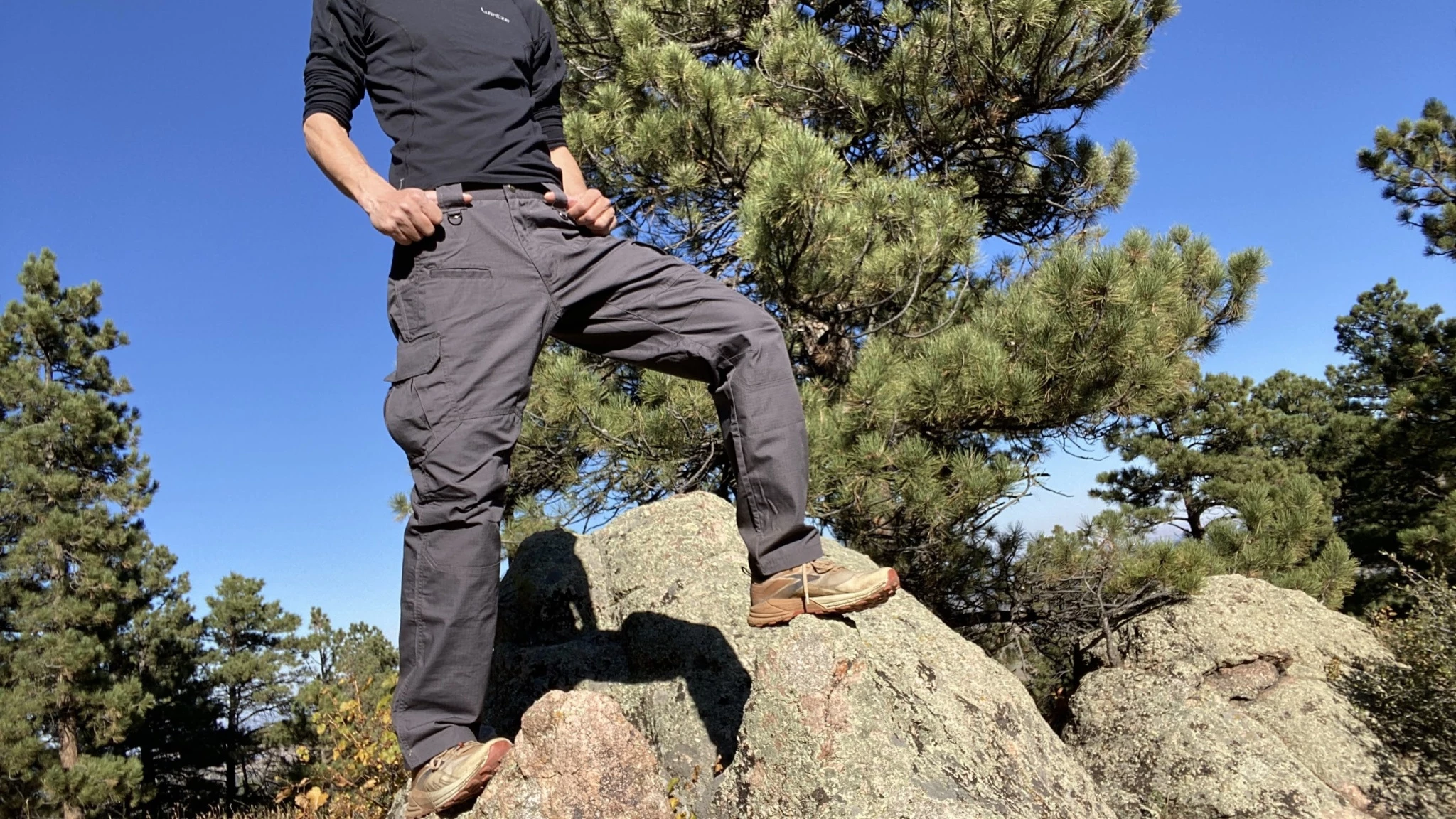 Hiking pants worn in a sunny environment illustrating fabric breathability and coverage.