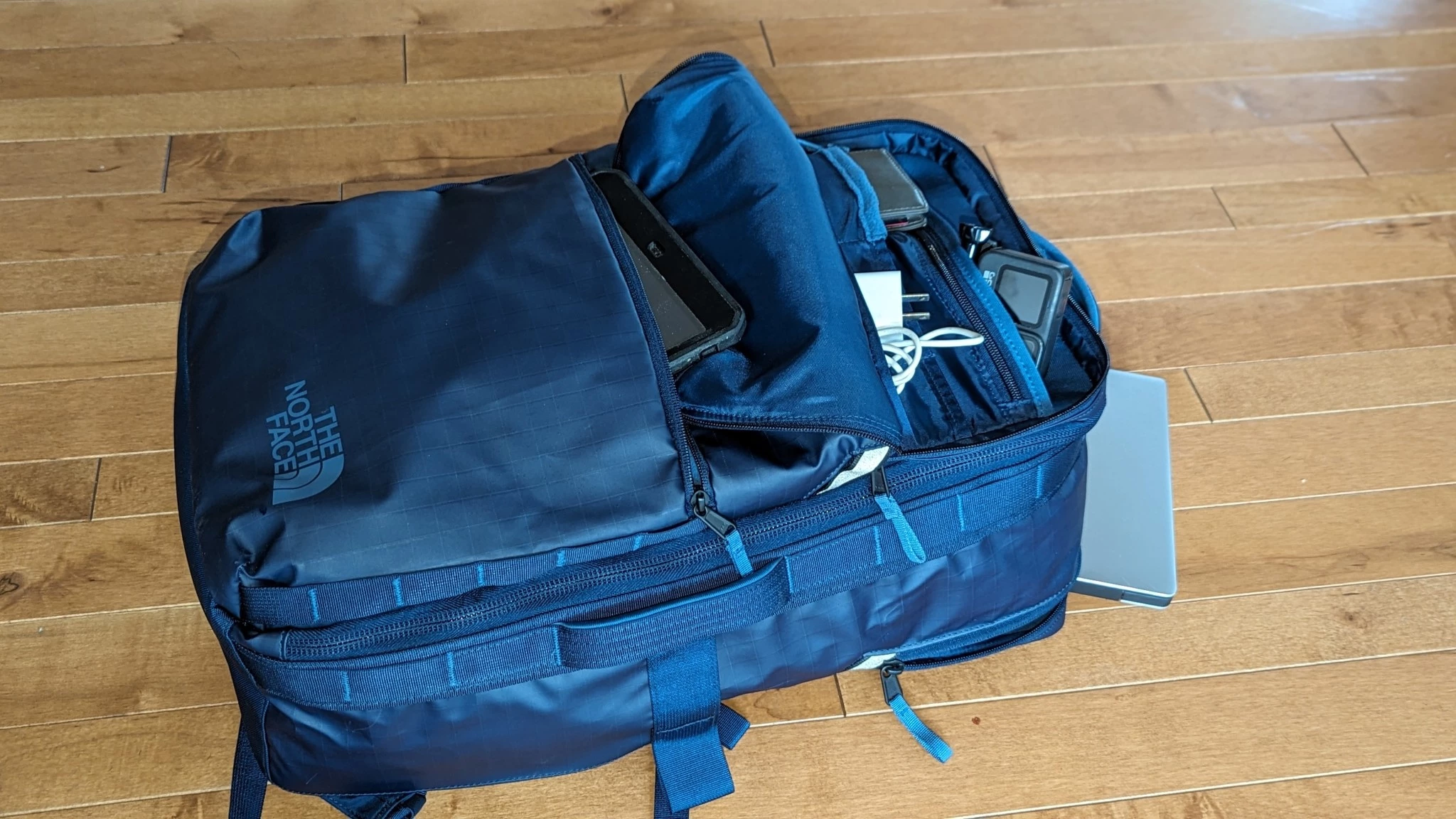 A compact, professional-looking travel backpack with multiple organization pockets.