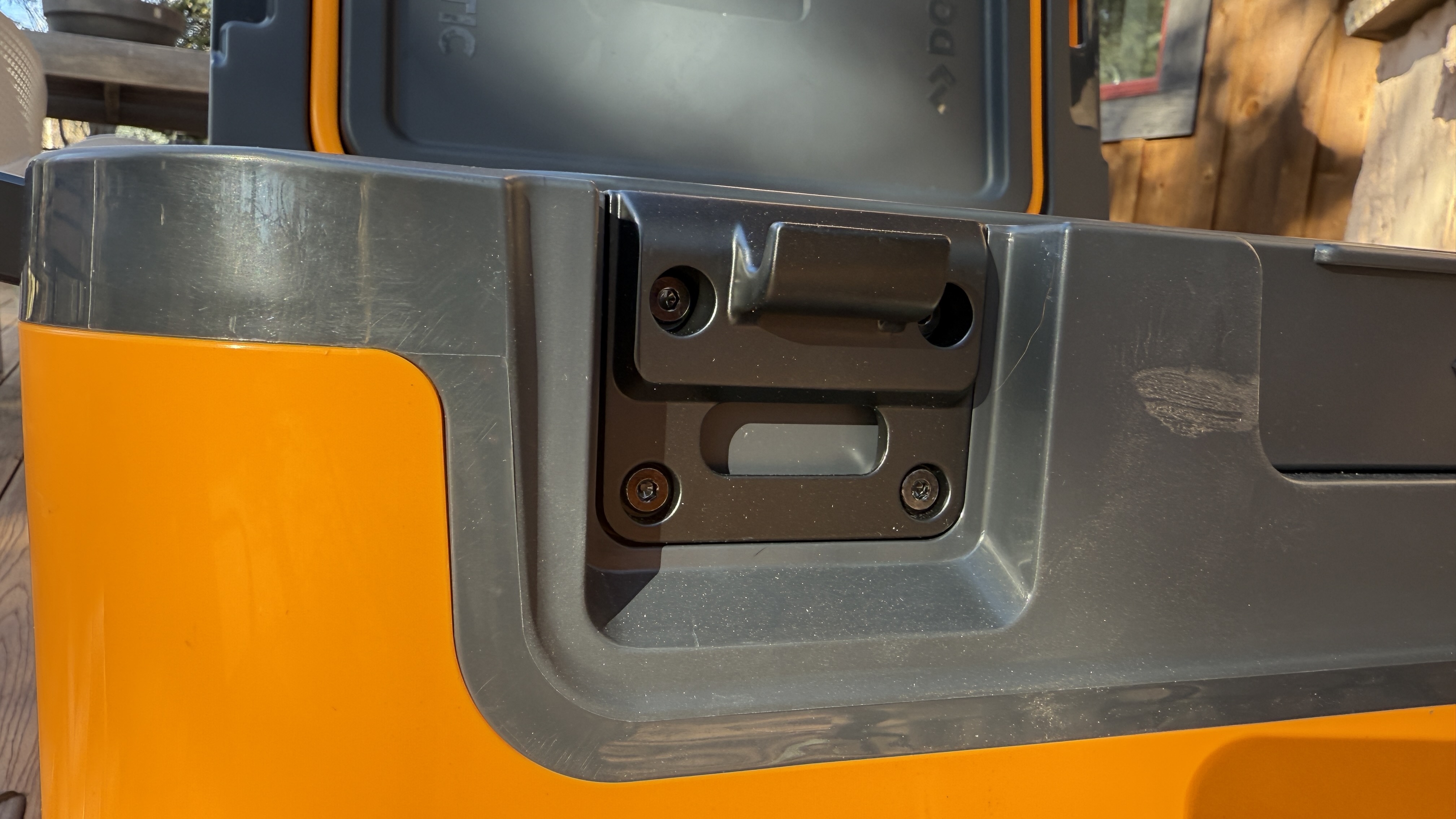 A close-up of the heavy-duty latches revealing integrated bottle openers.
