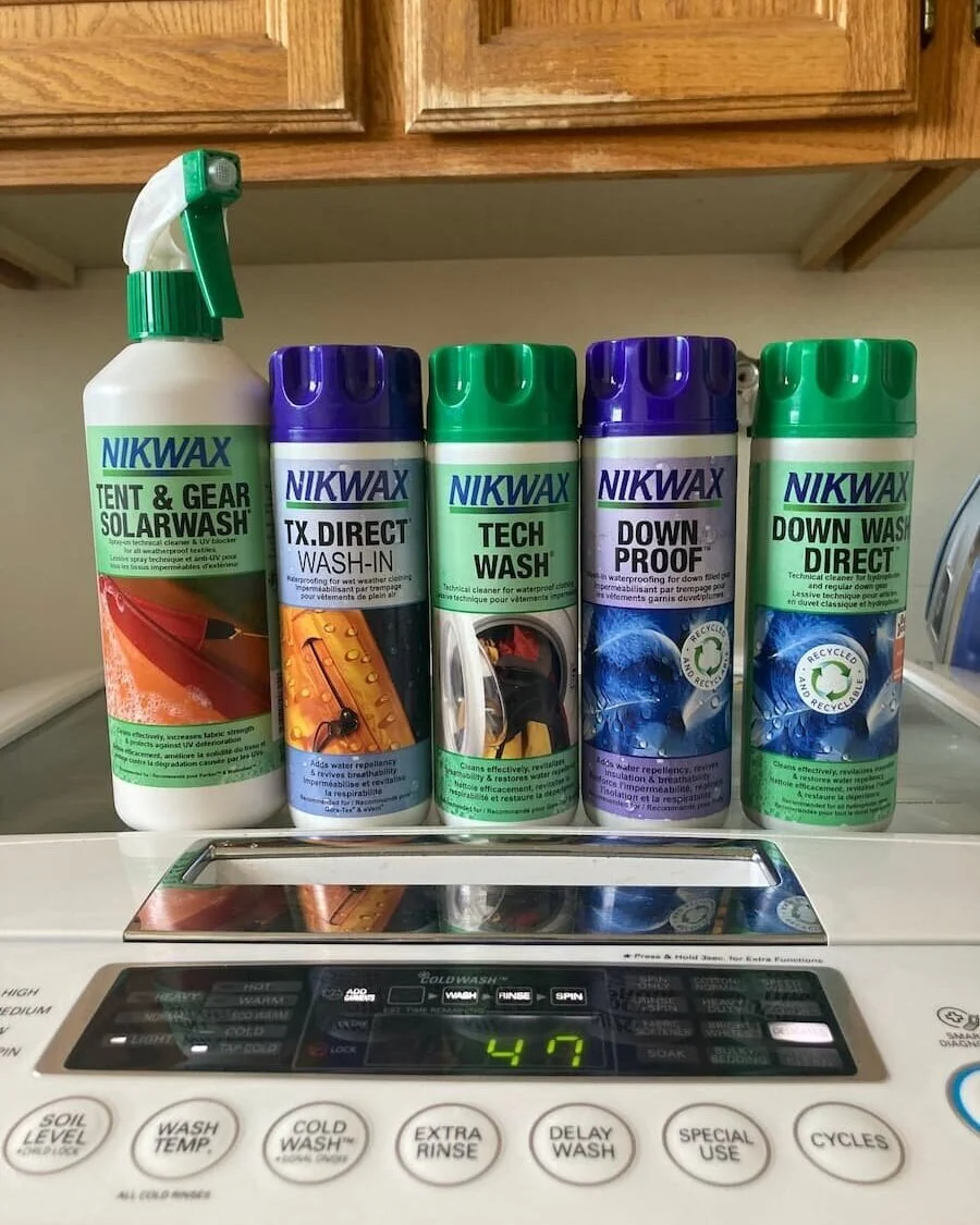 A bottle of specialized technical wash detergent used for cleaning breathable membranes.
