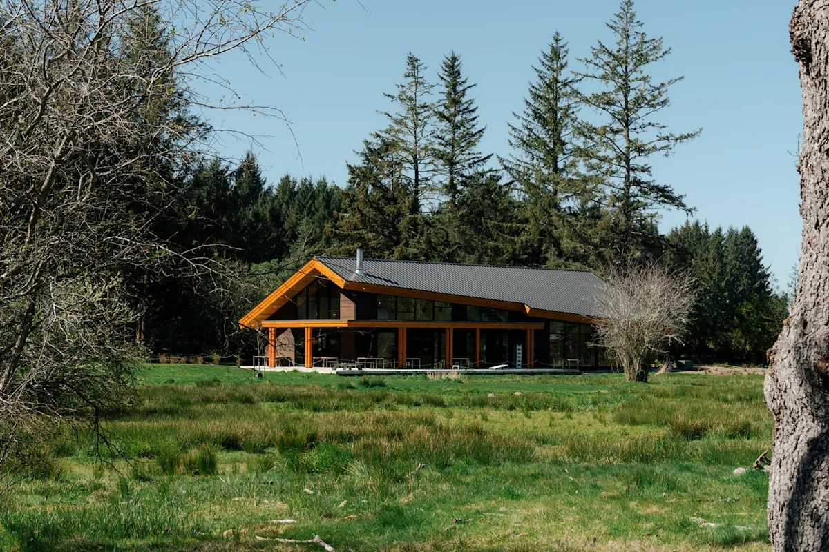 The exterior of the Snow Peak Campfield Lodge featuring modern wood paneling.