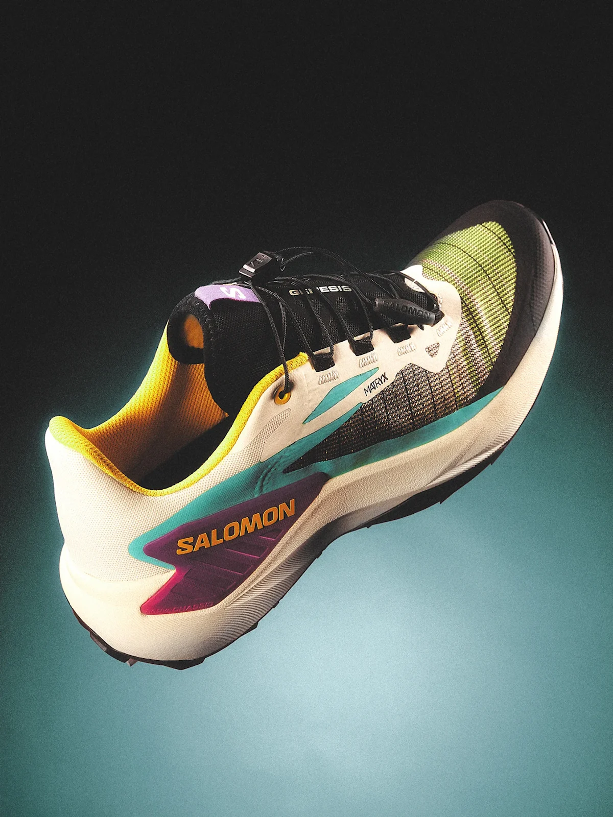 A studio profile shot of a technical Salomon Genesis trail running shoe.