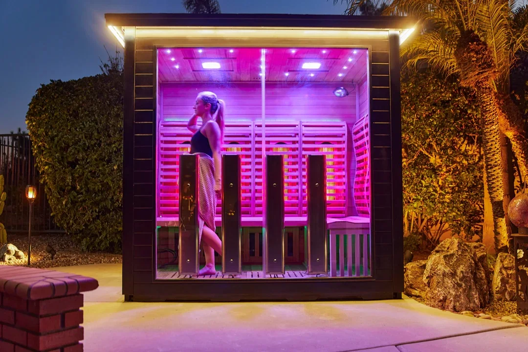 A contemporary infrared sauna interior featuring integrated radiant heating panels.