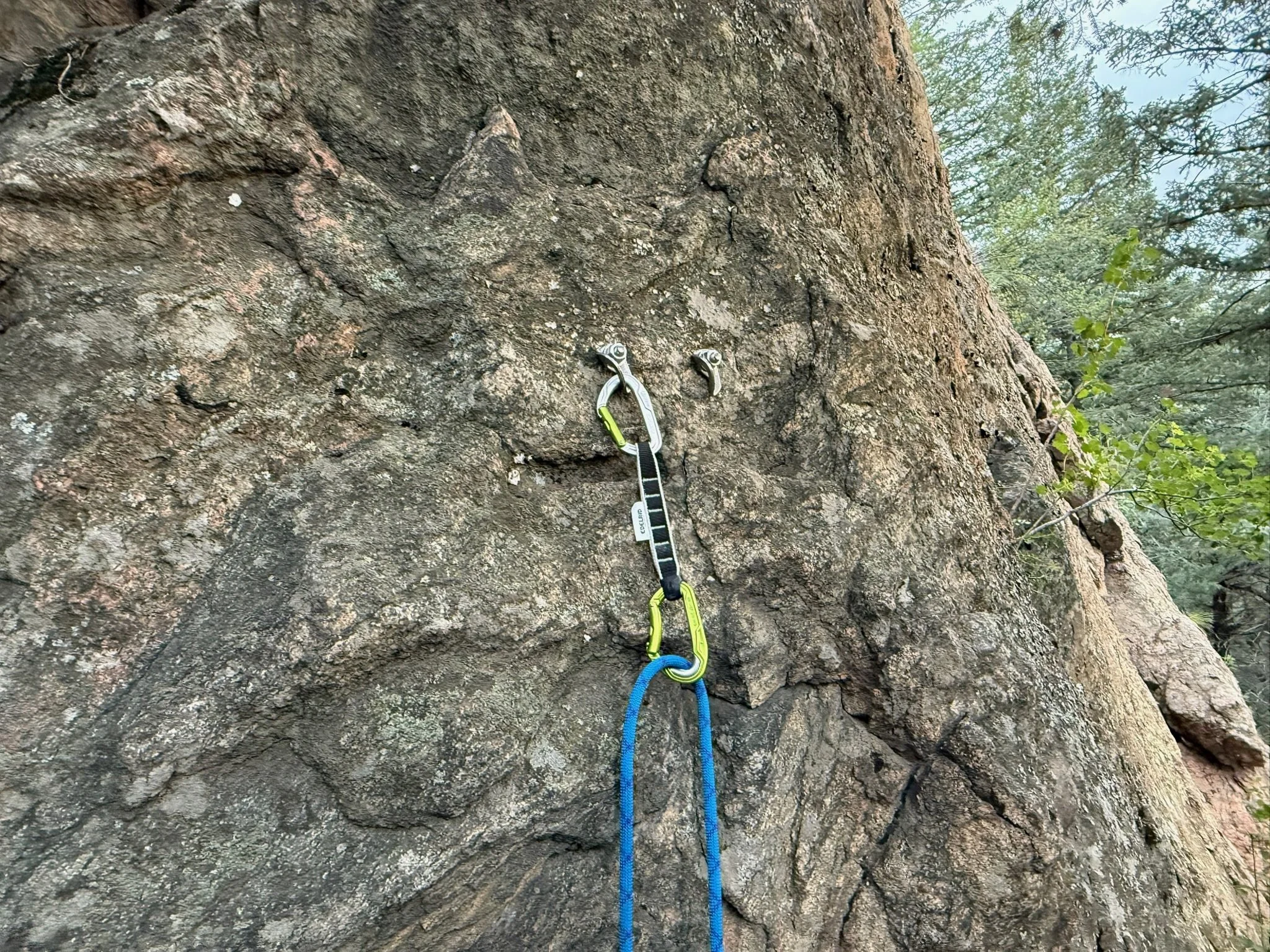Detail of the stainless steel insert on the rope-end carabiner of an Edelrid Bulletproof quickdraw.