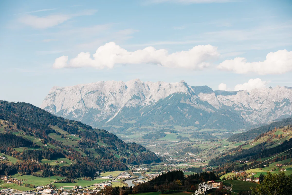 Overlooking a tranquil green valley in the Pongau region with traditional alpine architecture.