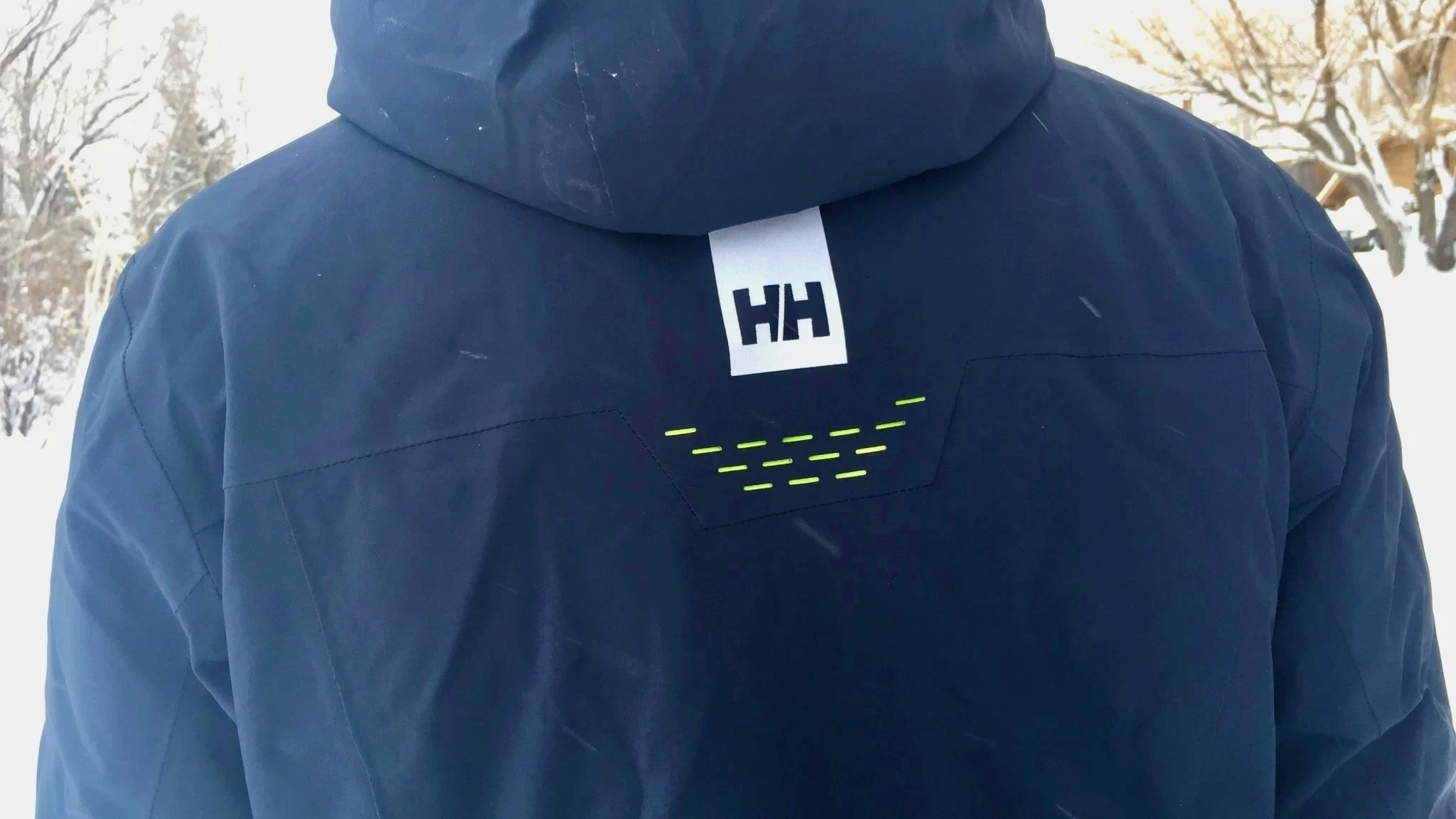 Close-up of the unique ventilation slits on the back of a Helly Hansen ski jacket.