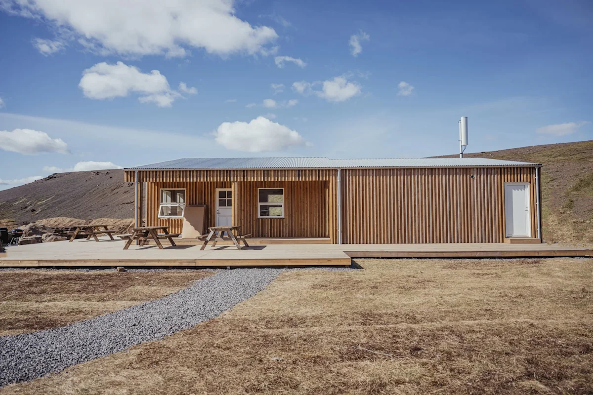 The Highland Base at Kerlingarfjöll featuring modern A-frame structures against a mountain backdrop.