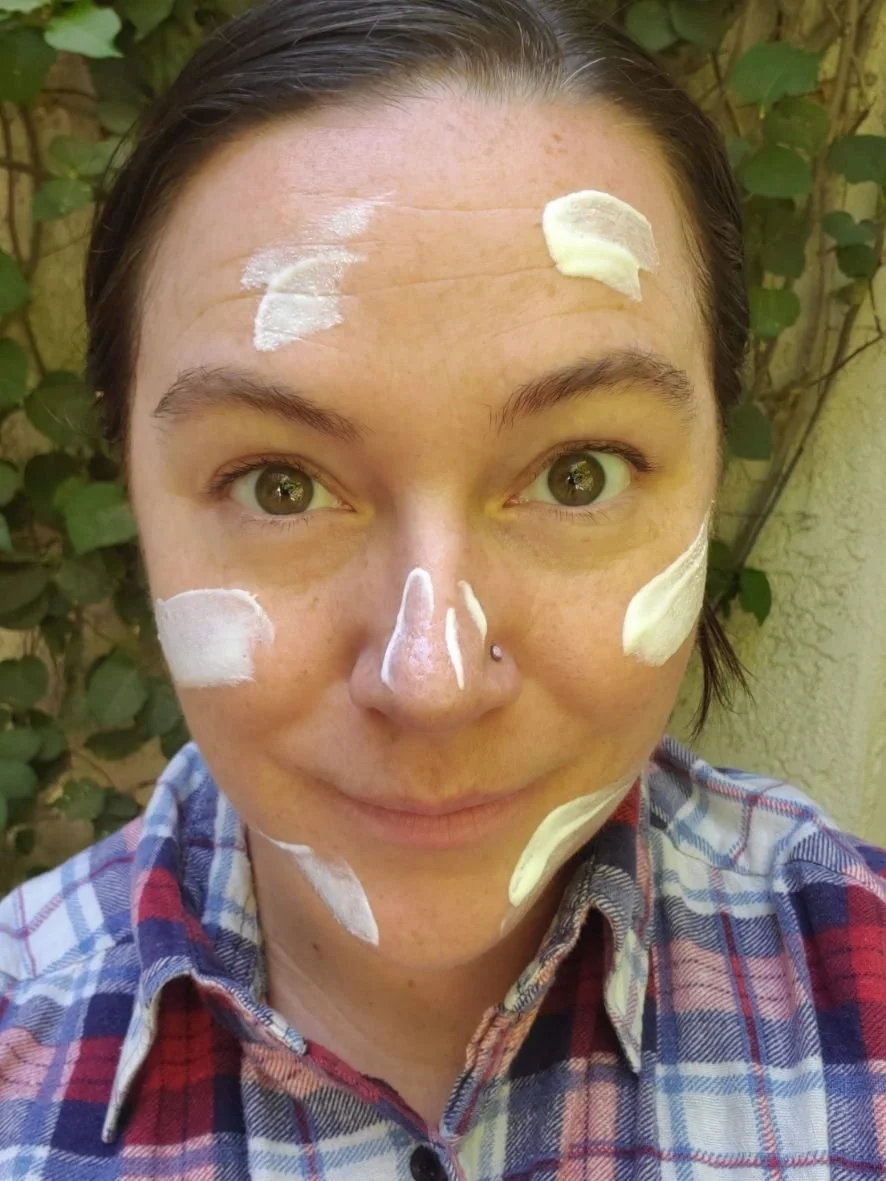 Sunscreen textures compared side-by-side on skin to evaluate rubbing in clarity.